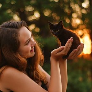 Pet wellness - Image of cat and owner